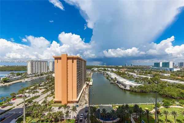 a view of a city with lots of residential buildings lake and ocean view