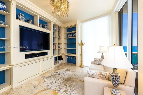 a living room with furniture and a rug