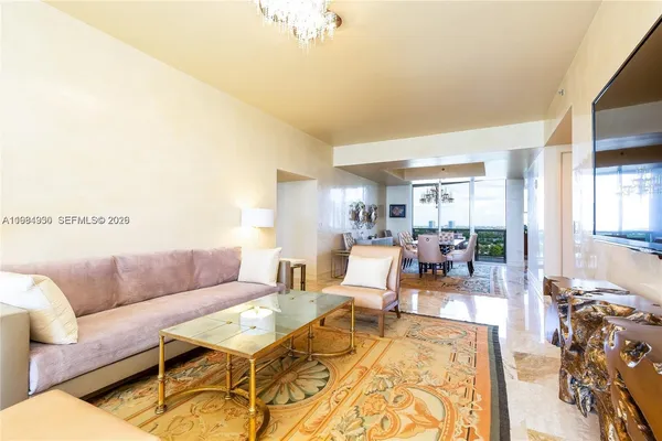 a living room with furniture and a rug