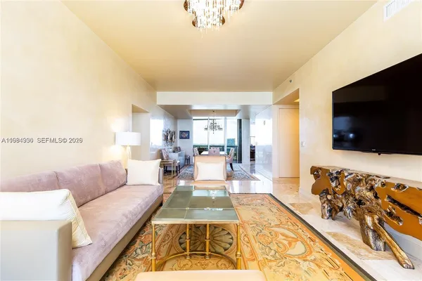 a living room with a flat screen tv and a couch
