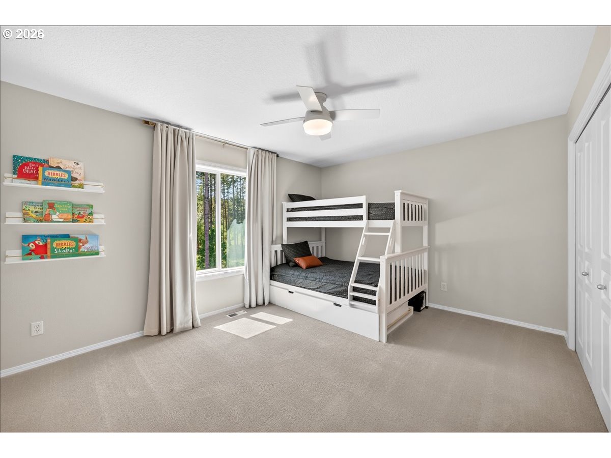 28311 Northwest Nowakowski Road Buxton, OR 97109 - Photo 29 of 48 a bedroom with furniture and a ceiling fan