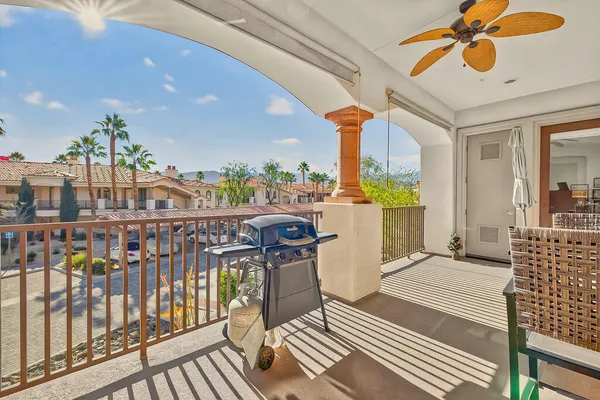 a view of a balcony with furniture