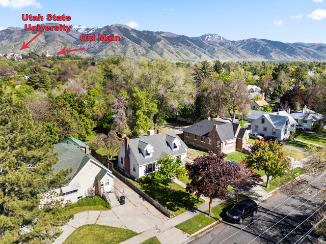658 North 100 East Logan, UT 84321 - Photo 20 of 26 Neighborhood setting with mountain backdrop and mature trees