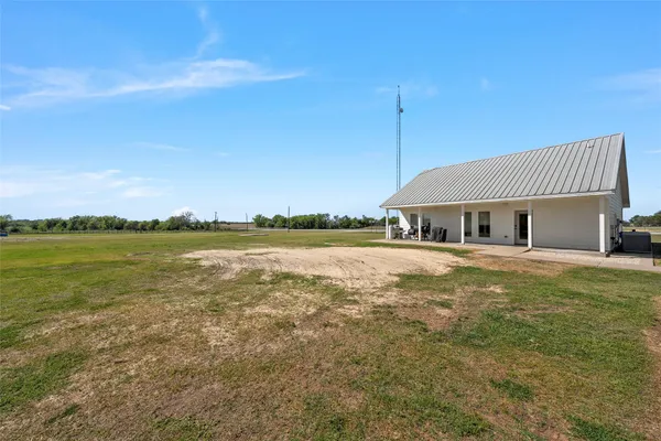 a large kitchen with stainless steel appliances granite countertop a stove a sink dishwasher and cabinets with wooden floor