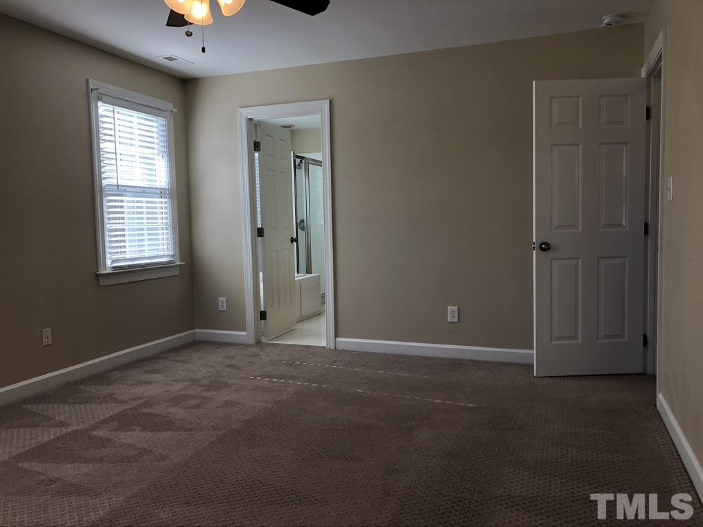 200 Oak Pine Drive Apex, NC 27502 - Photo 17 of 26 an empty room with windows and closet