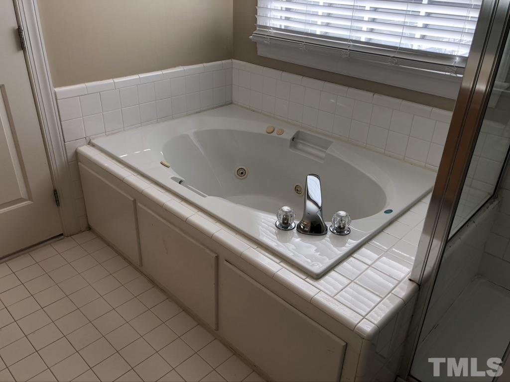 200 Oak Pine Drive Apex, NC 27502 - Photo 19 of 26 a bathroom with a sink and a mirror