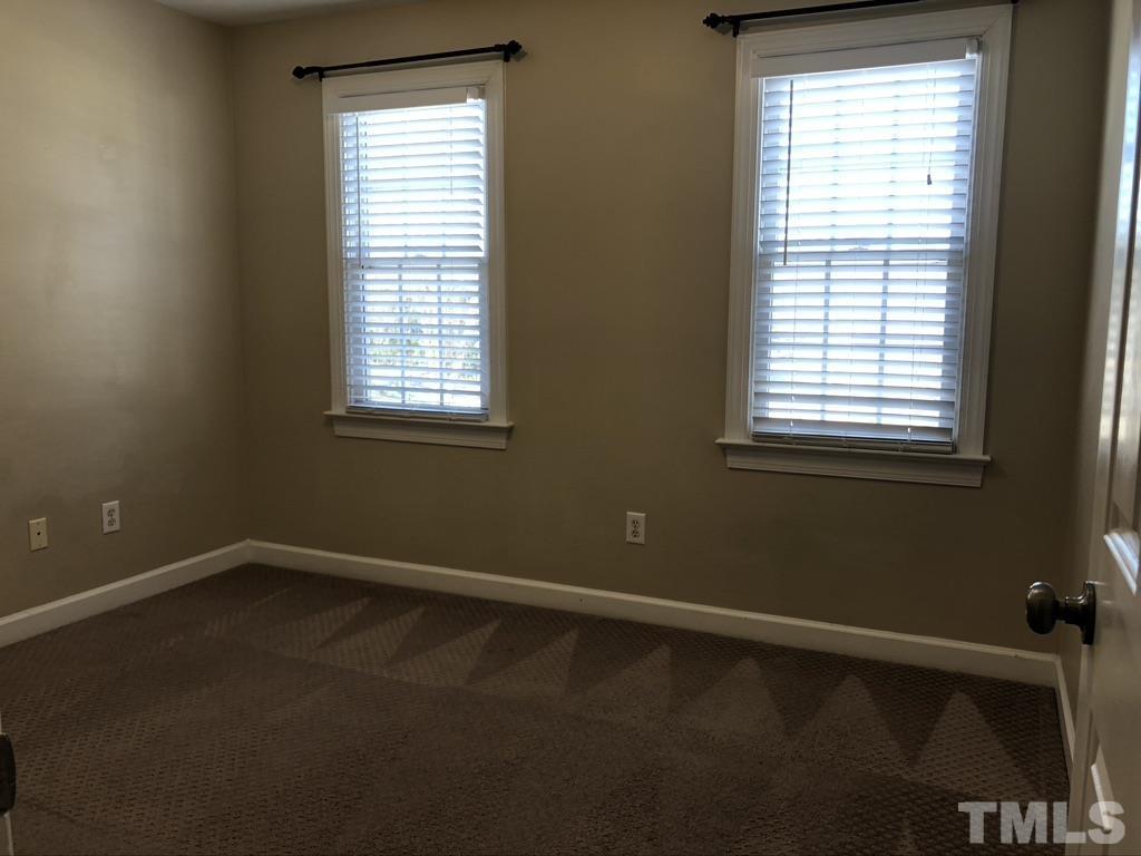 200 Oak Pine Drive Apex, NC 27502 - Photo 21 of 26 a view of an empty room with a window