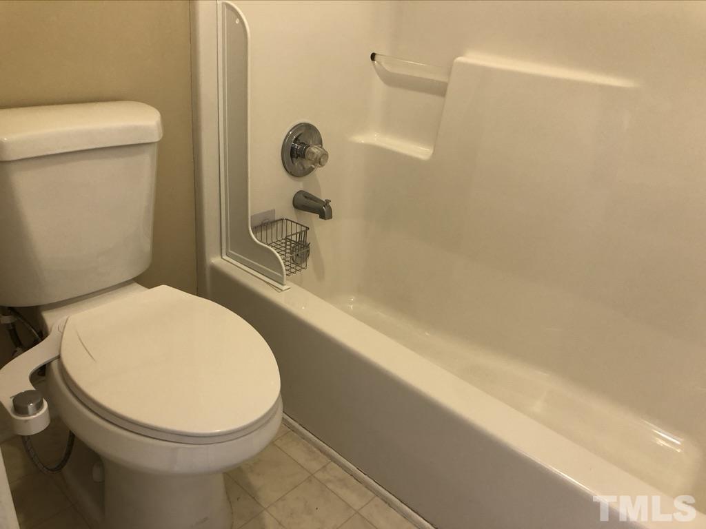 200 Oak Pine Drive Apex, NC 27502 - Photo 23 of 26 a bathroom with a toilet and a shower