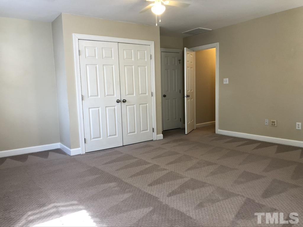 200 Oak Pine Drive Apex, NC 27502 - Photo 25 of 26 a view of an empty room with closet area