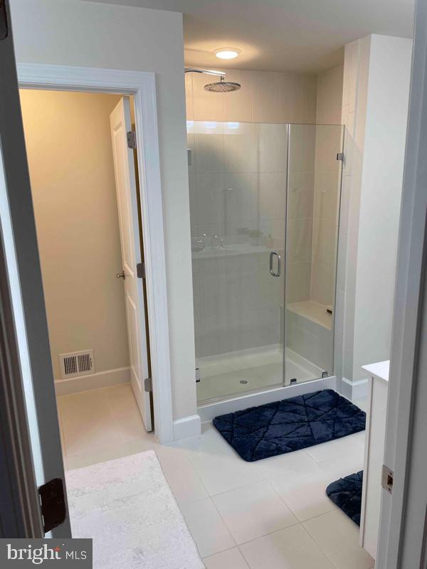 2821 Duvall Ridge Road, Unit 537 Hyattsville, MD 20785 - Photo 10 of 13 Modern bathroom with sleek glass shower.