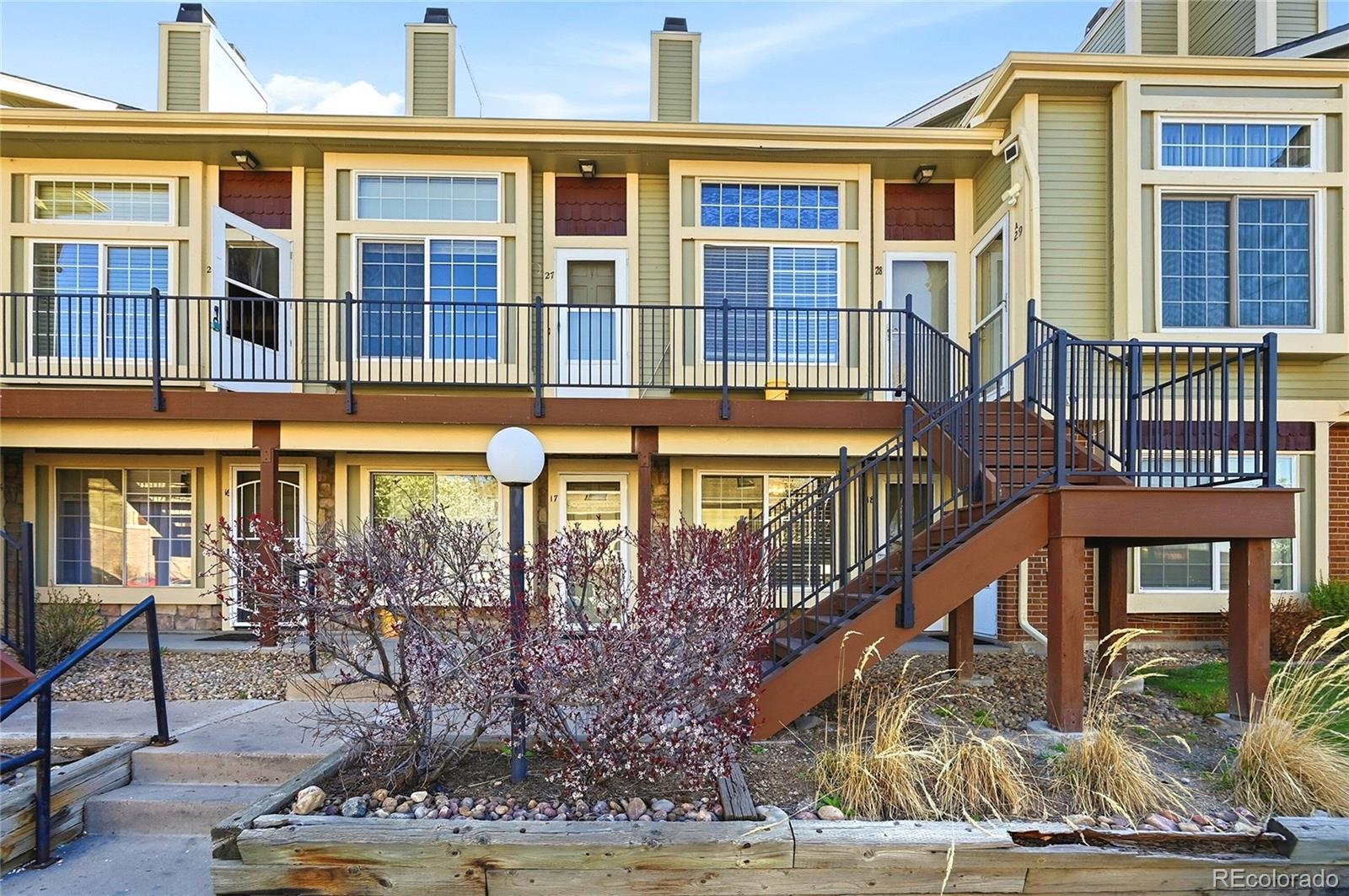 1885 South Quebec Way, Unit A18 Denver, CO 80231 - Photo 1 of 31 front view of a building with a fountain