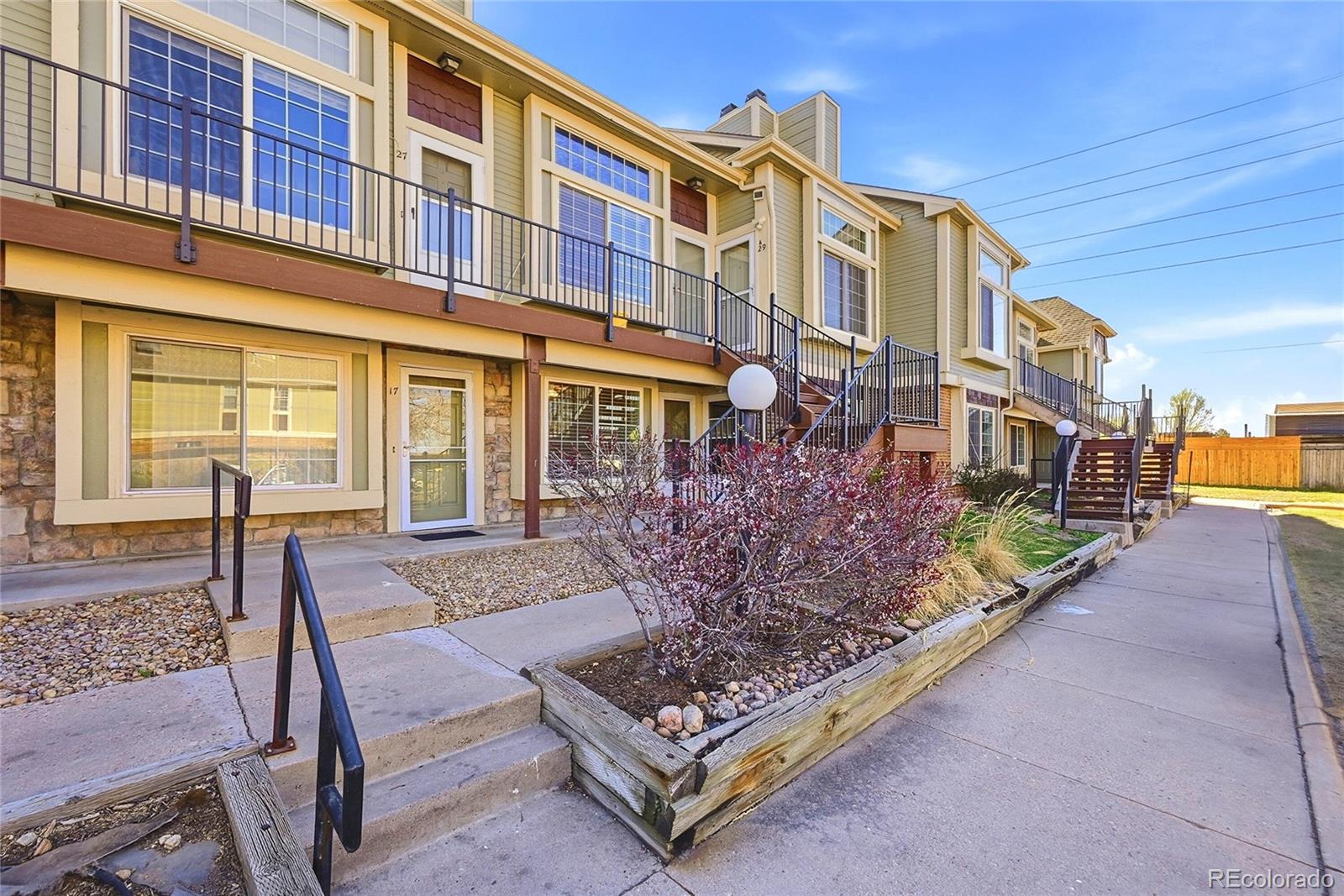 1885 South Quebec Way, Unit A18 Denver, CO 80231 - Photo 2 of 31 a view of a house with a patio