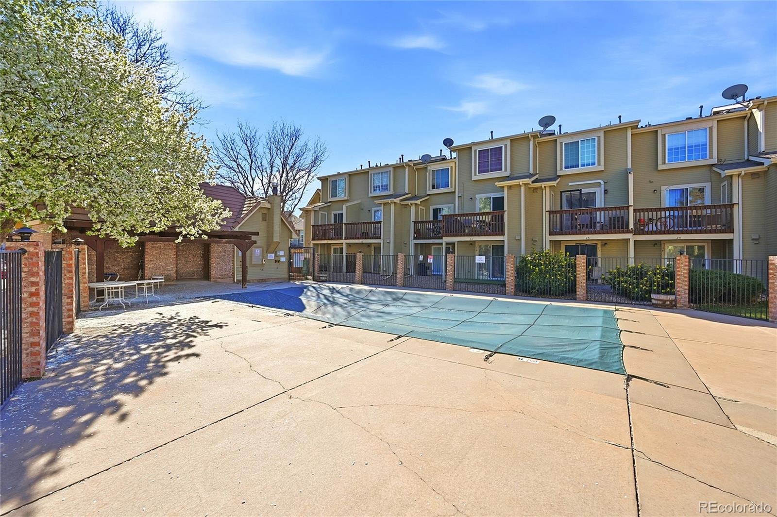 1885 South Quebec Way, Unit A18 Denver, CO 80231 - Photo 23 of 31 a view of a building with a street