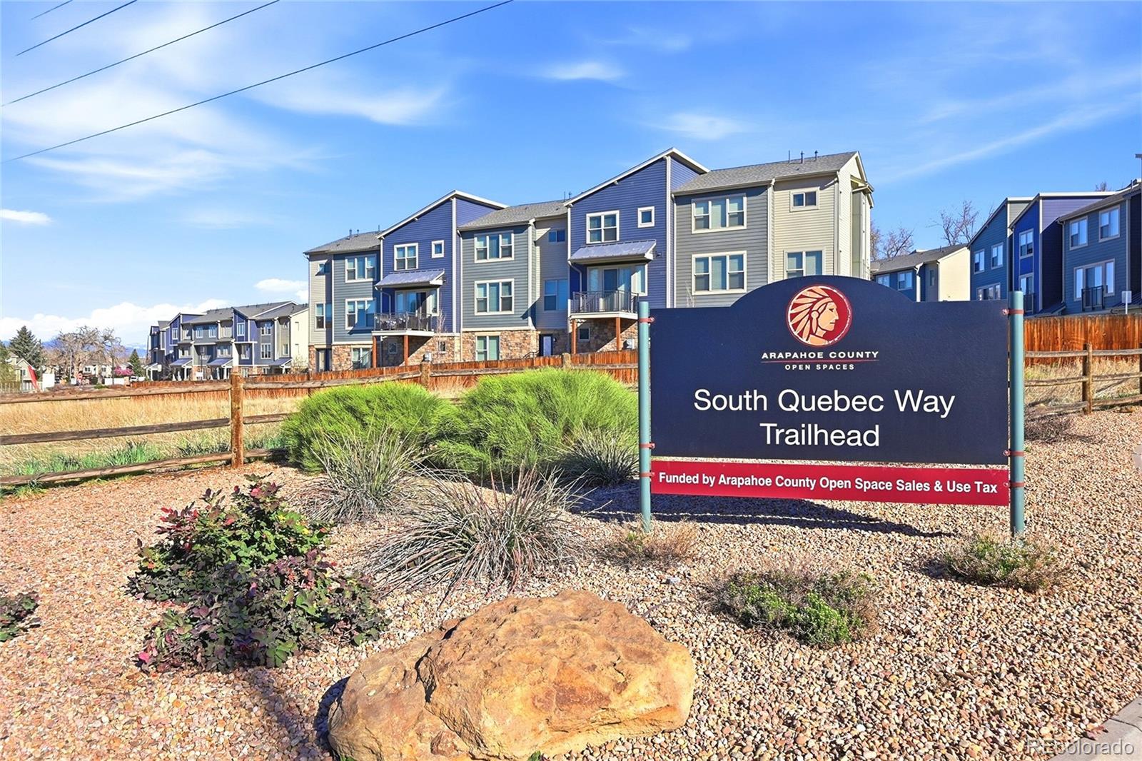 1885 South Quebec Way, Unit A18 Denver, CO 80231 - Photo 24 of 31 a sign on the side of a building