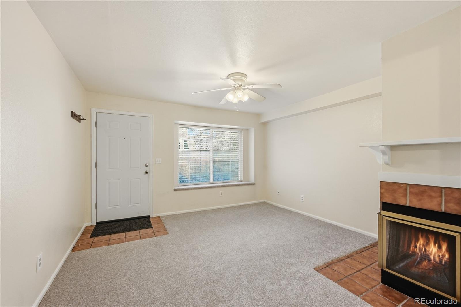 1885 South Quebec Way, Unit A18 Denver, CO 80231 - Photo 7 of 31 a view of an empty room with a window