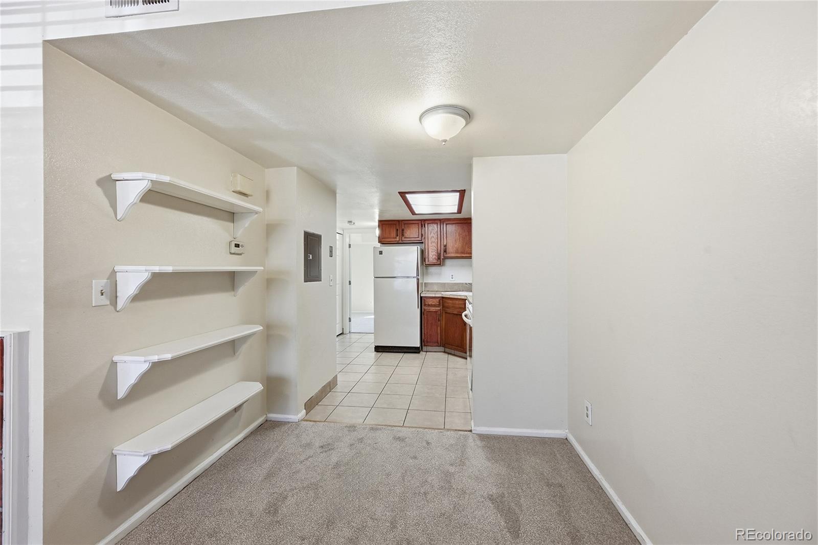 1885 South Quebec Way, Unit A18 Denver, CO 80231 - Photo 9 of 31 a view of kitchen and utility room
