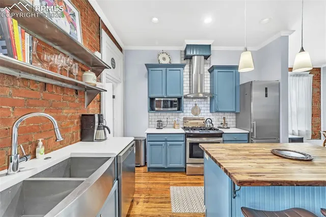 a view of a hallway with furniture and stairs