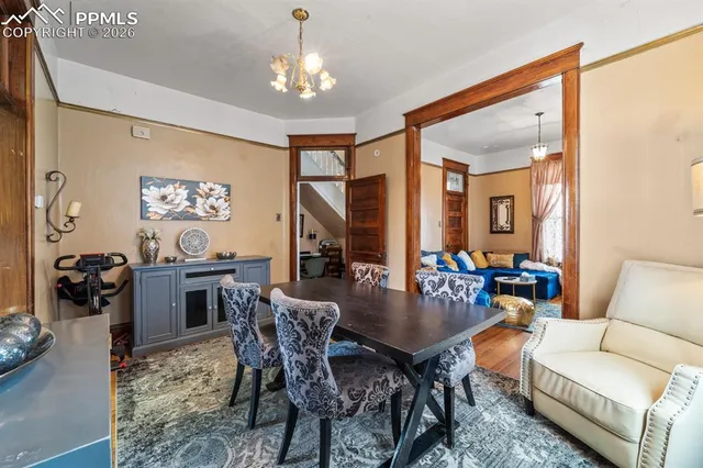 a room with a bed and a refrigerator