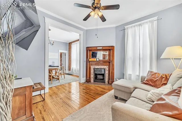 a living room with furniture and a fireplace