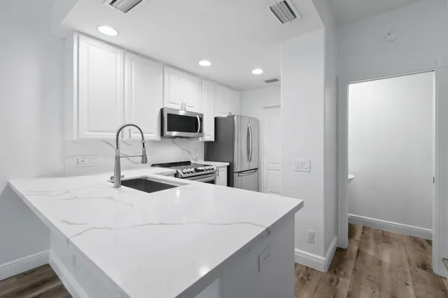 a kitchen with a stove and a microwave