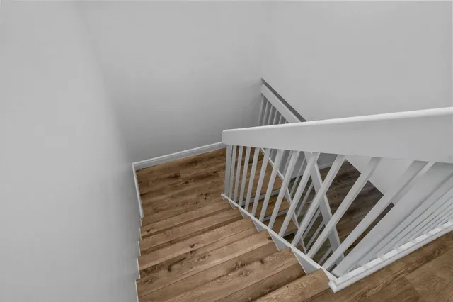 a bathroom with double sink and a mirror