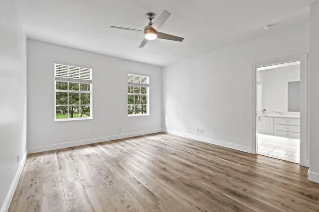 a bathroom with double sink and a mirror