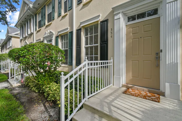 a view of a house with a door and wooden floor