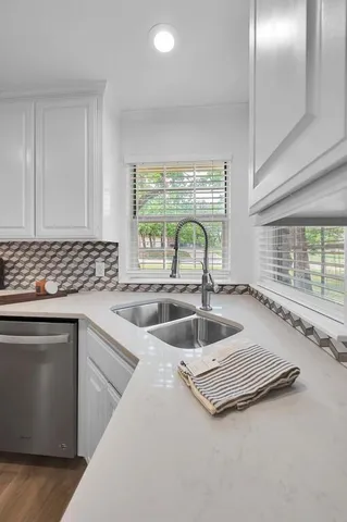 a view of workspace with cabinets