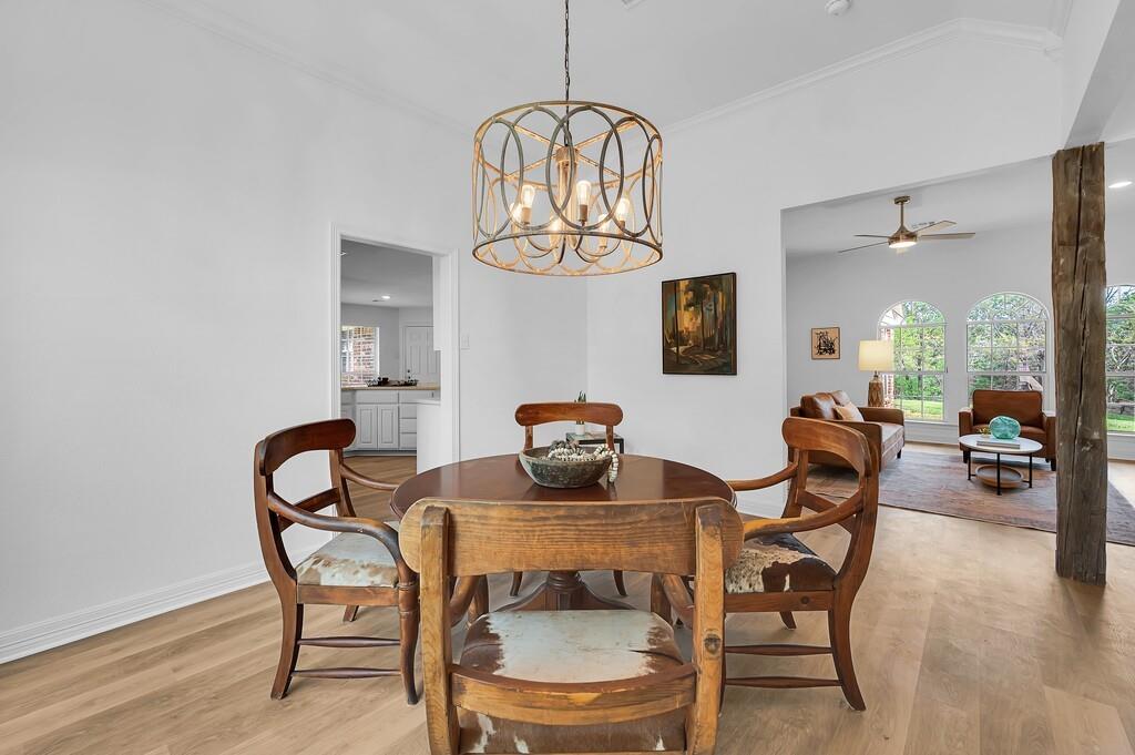 1068 Brazos Bluff Drive China Spring, TX 76633 - Photo 21 of 40 a view of a dining room with furniture wooden floor and chandelier