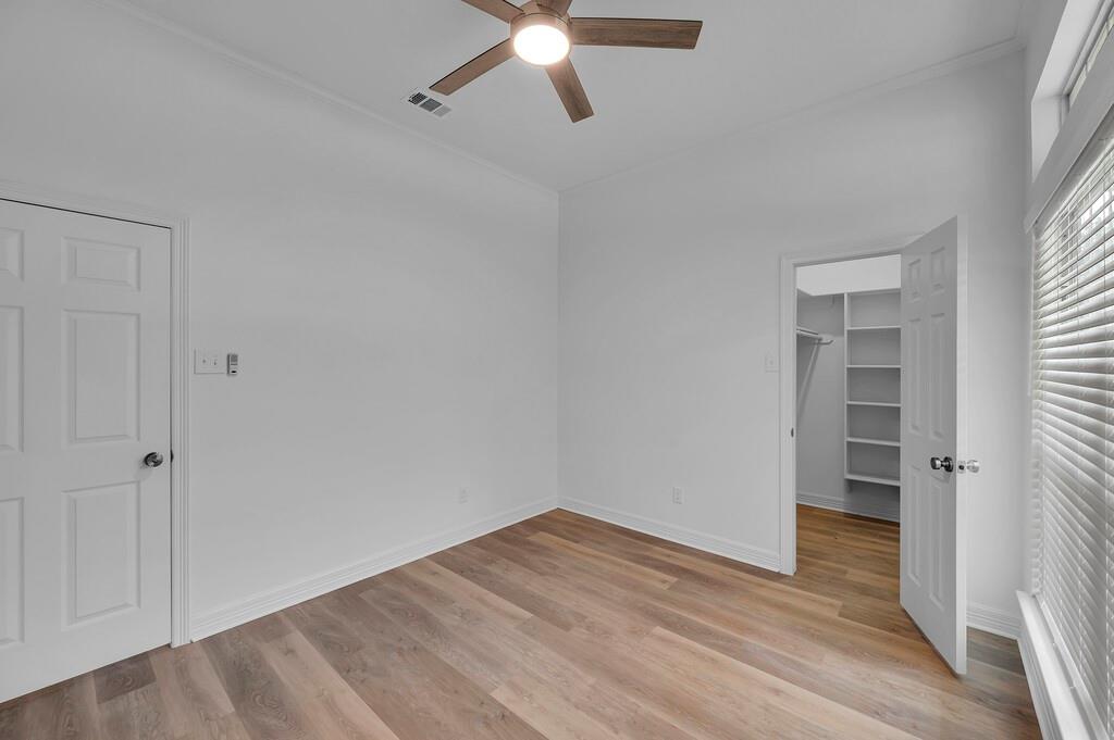 1068 Brazos Bluff Drive China Spring, TX 76633 - Photo 28 of 40 an empty room with wooden floor closet and windows