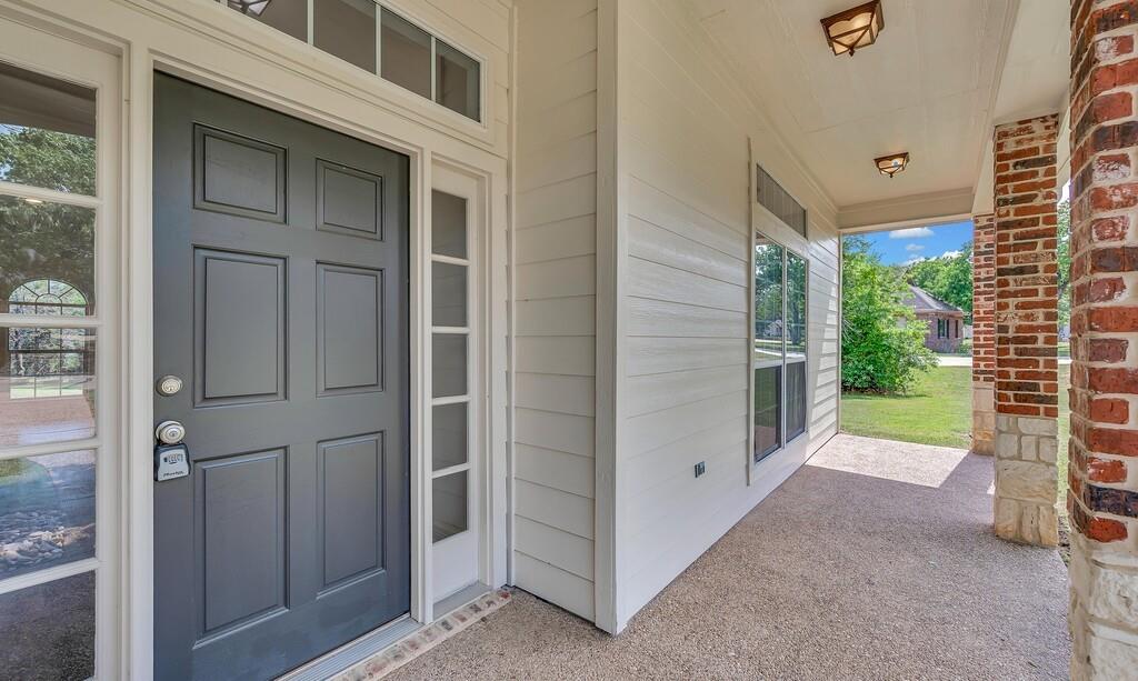 1068 Brazos Bluff Drive China Spring, TX 76633 - Photo 3 of 40 a view of a porch with a door and a porch