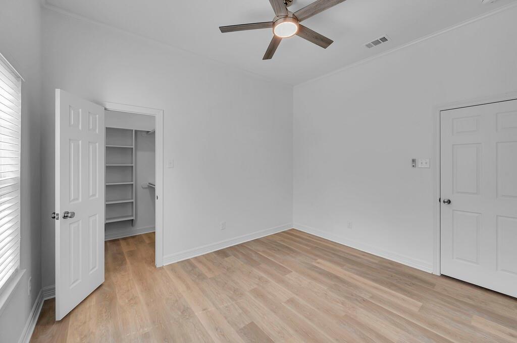 1068 Brazos Bluff Drive China Spring, TX 76633 - Photo 32 of 40 wooden floor in an empty room with a window