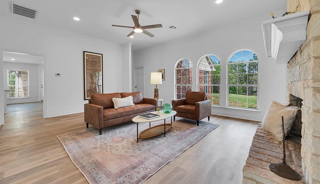 1068 Brazos Bluff Drive China Spring, TX 76633 - Photo 5 of 40 a living room with furniture fireplace and a large window