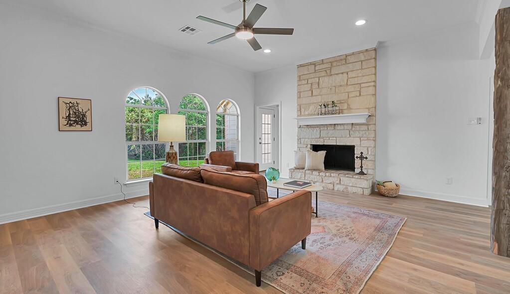 1068 Brazos Bluff Drive China Spring, TX 76633 - Photo 6 of 40 a living room with furniture and a fireplace