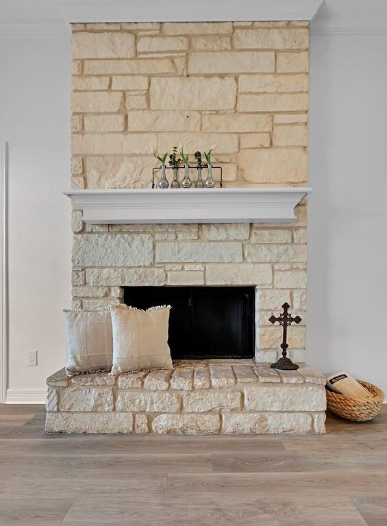 1068 Brazos Bluff Drive China Spring, TX 76633 - Photo 8 of 40 a living room with a fireplace and a ceiling fan