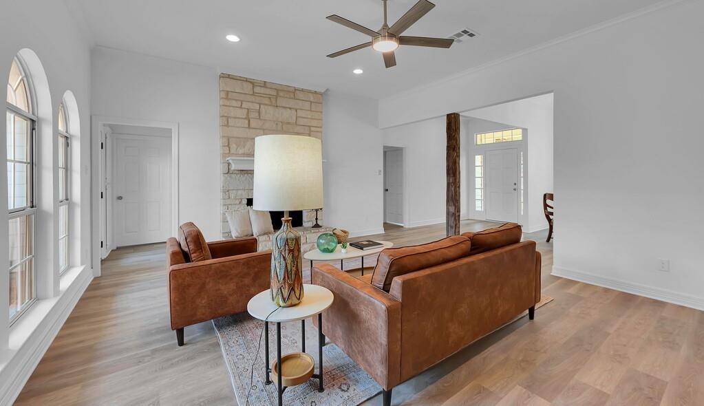 1068 Brazos Bluff Drive China Spring, TX 76633 - Photo 9 of 40 a living room with furniture and a wooden floor