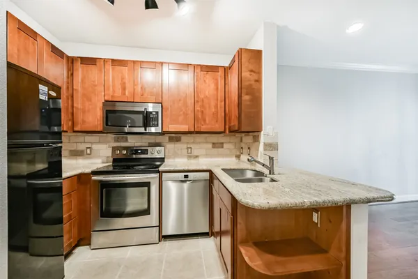 a view of a glass door with a door and a chair