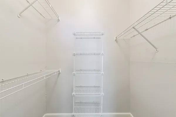 front view of a building with potted plants