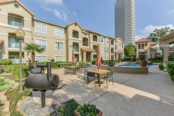 a room with lots of chairs and mirrors