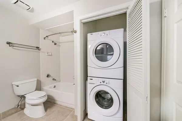 a kitchen with granite countertop a sink a stove and microwave