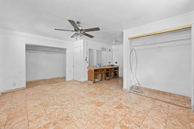a view of kitchen with stainless steel appliances kitchen island