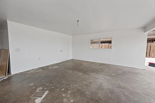 a view of a livingroom with furniture and front door