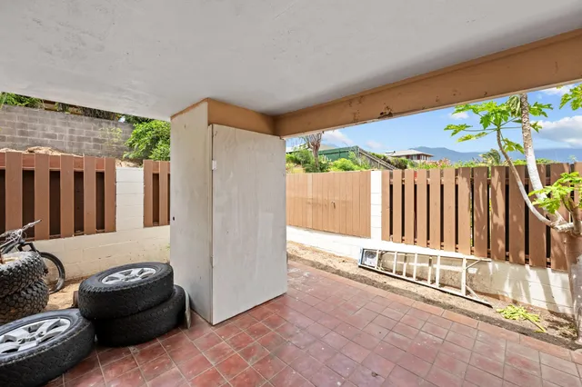 a kitchen with stainless steel appliances kitchen island granite countertop a sink and cabinets