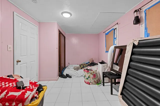 a bathroom with a window and a shower