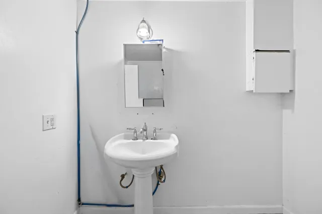 a kitchen with a refrigerator and cabinets