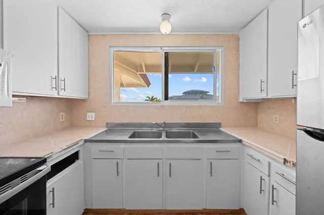 a view of an empty room and a window