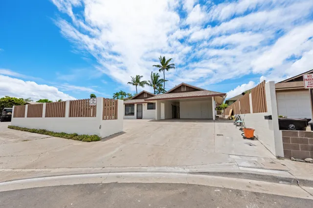 a view of a kitchen with a sink wooden floor and a window