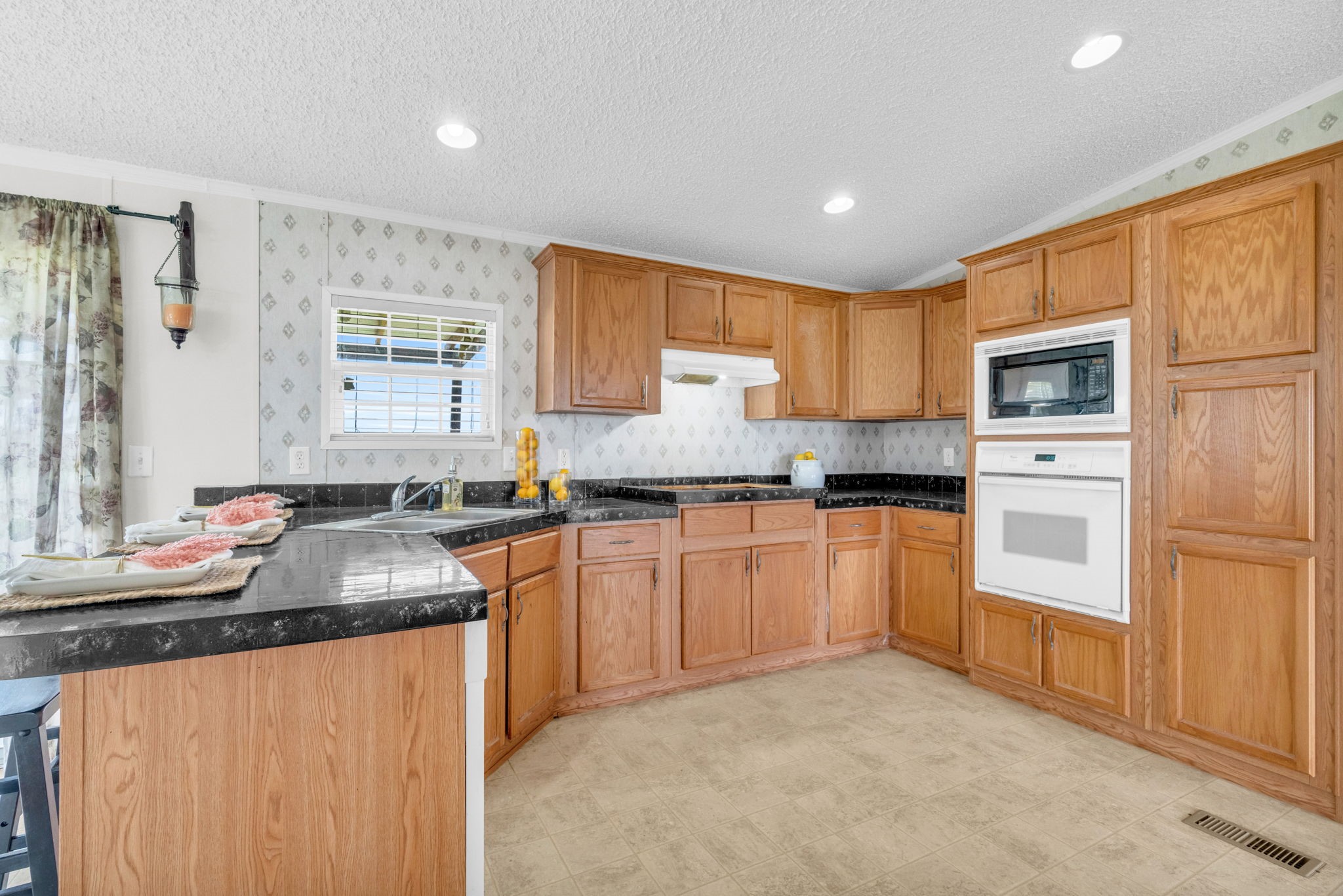 37038 Bell Road Waller, TX 77484 - Photo 17 of 43 a kitchen with stainless steel appliances granite countertop a sink stove and refrigerator