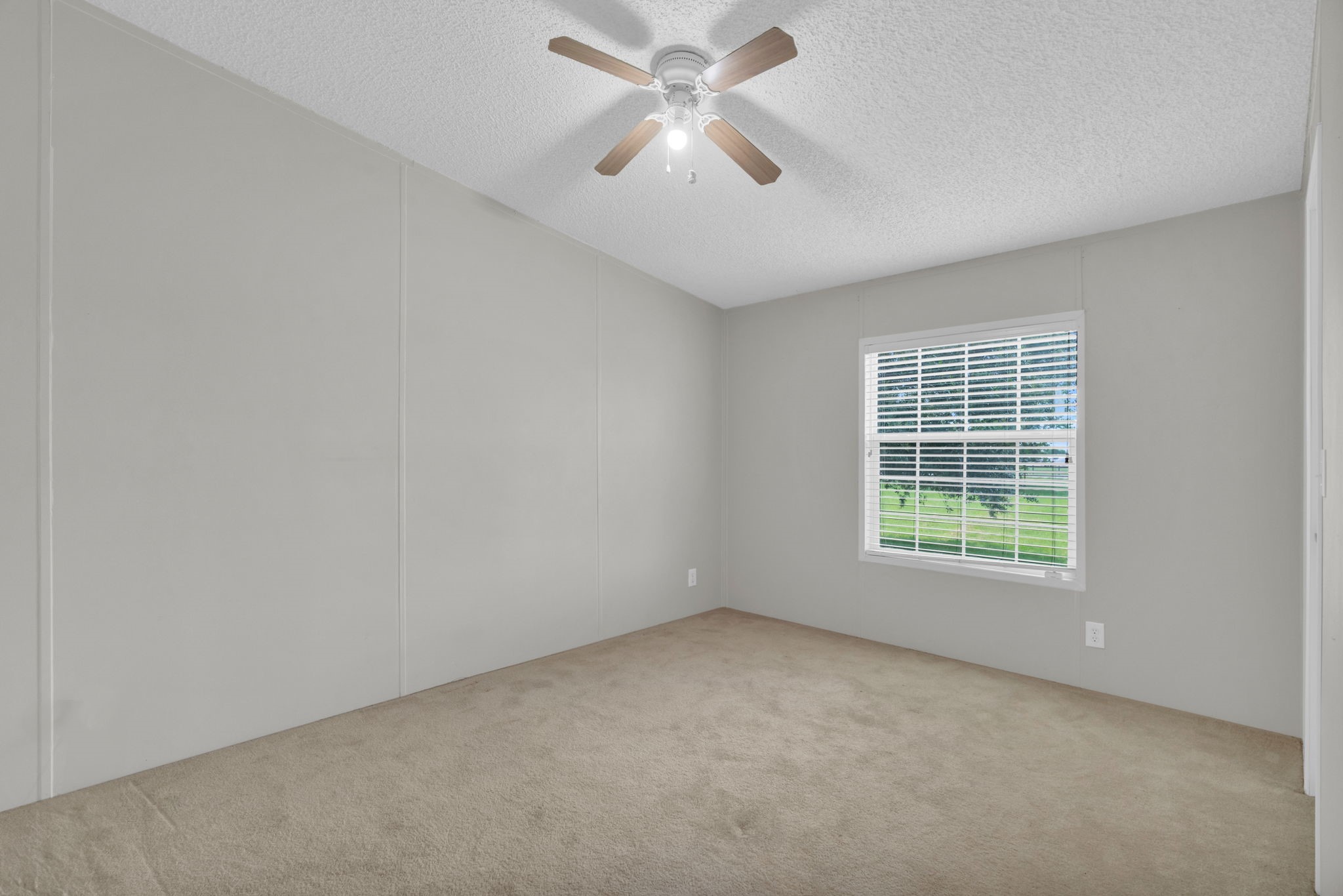 37038 Bell Road Waller, TX 77484 - Photo 27 of 43 an empty room with a window and a fan