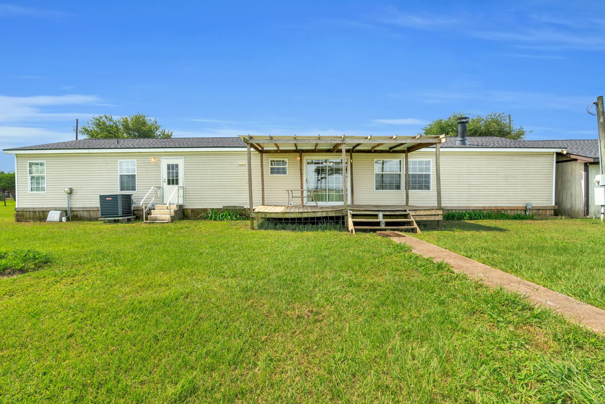 37038 Bell Road Waller, TX 77484 - Photo 8 of 43 a front view of house with yard and outdoor seating